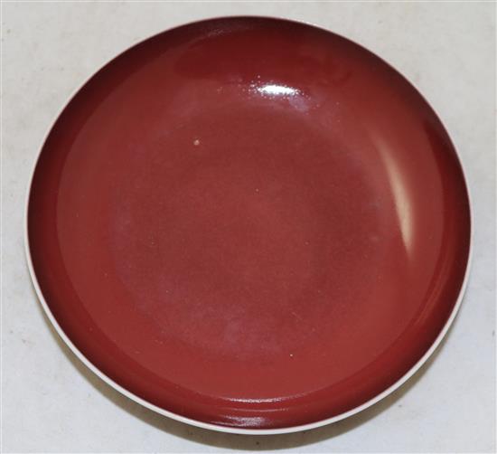 A Chinese sang-de-boeuf glazed dish, Qianlong seal mark and of the period (1736-95), 16.3cm